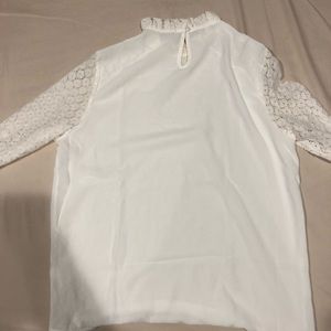White long sleeve woman’s blouse.